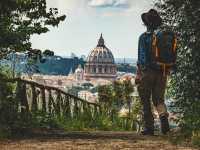Pilgrim walking into St Peters in Rome at the end of the Via Francigena |  Tim Charody