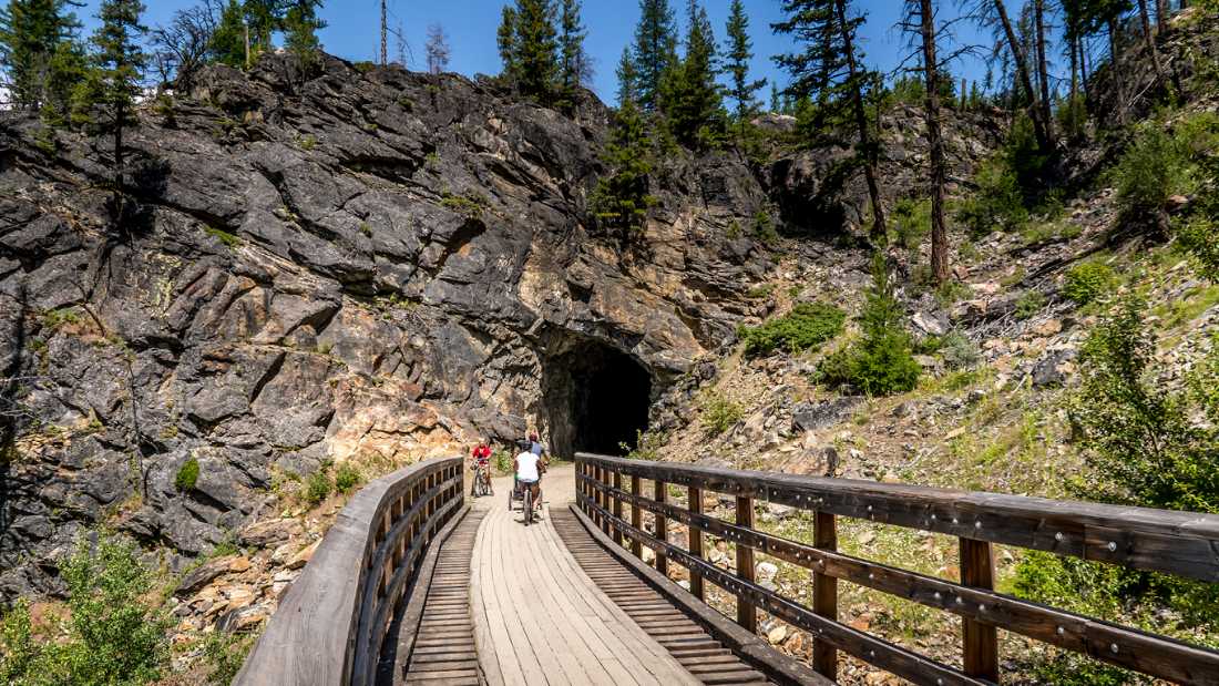 Cycling through the old railway tunnels in Myra Canyon