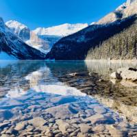Admiring the crystal clear water of Lake Louise | Caroline Mongrain