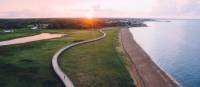 Hiking on the Bouctouche Dune boardwalk at sunset