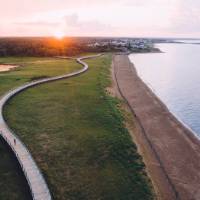 Hiking on the Bouctouche Dune boardwalk at sunset