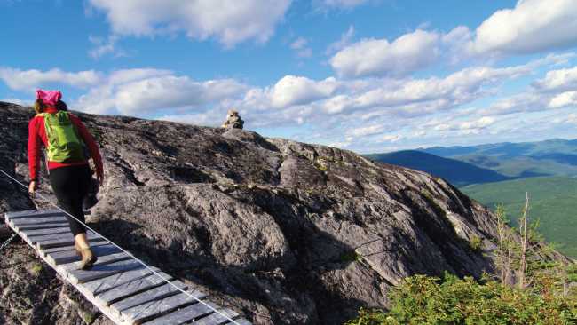 Bridges cross peaks and cut through forest on the Charlevoix Traverse | Pierre Bouchard