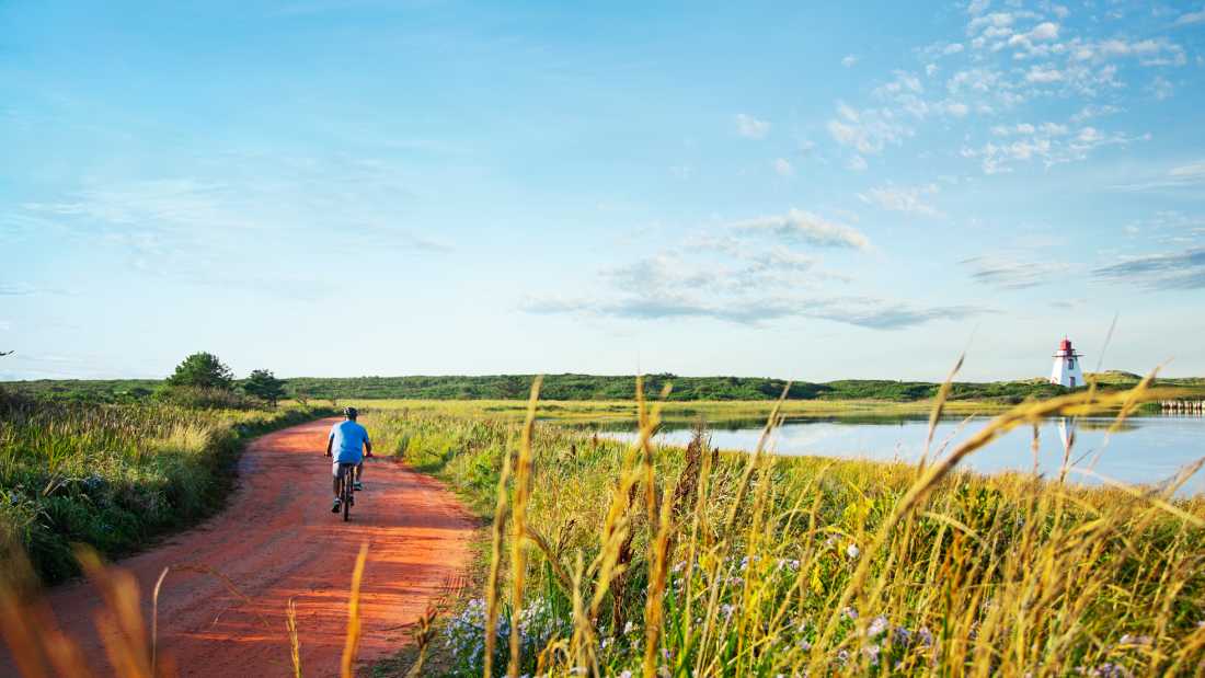 The peaceful beauty of St. Peters Harbour is best explored by bike | ©Tourism PEI / Stephen Harris