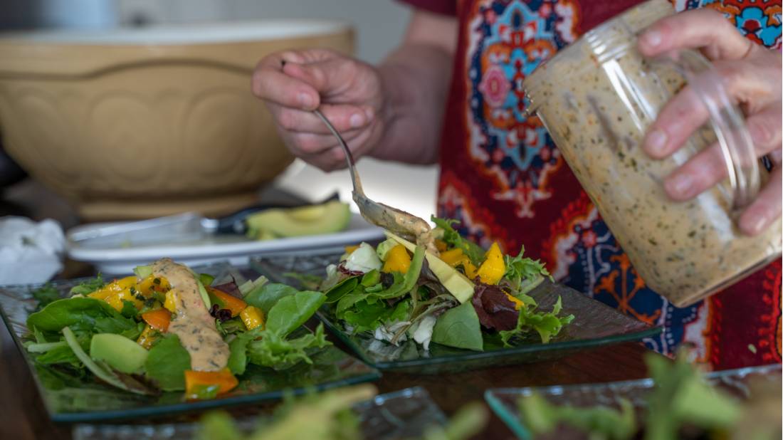 Our amazing host preparing a nutritious dinner for hungry hikers | <i>Sherry Ott</i>