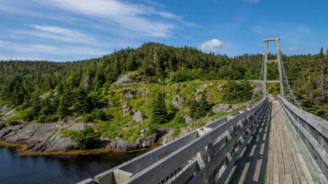 Suspension bridge to the former village of La Manche | Sherry Ott