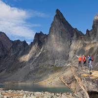 A captivating mountain range by a pristine lake in Tombstone Territorial Park | Government of Yukon/Fritz Mueller