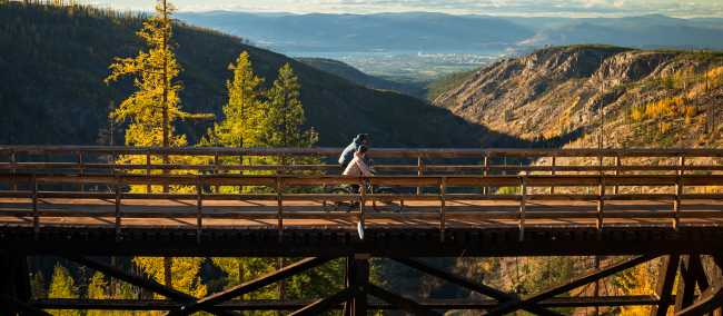Experience dramatic canyon views as you cycle across the Myra Canyon trestles | Tourism Kelowna / Ken Hagen