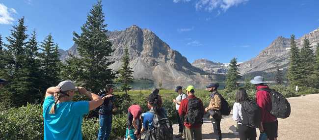 Group briefing on proper trail etiquette before the first hike of the tour | Kalaya Mckenzie